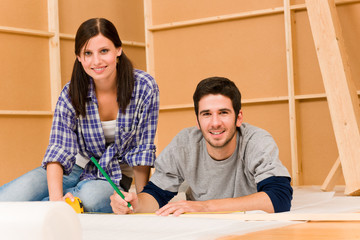 Home improvement young couple work on renovations