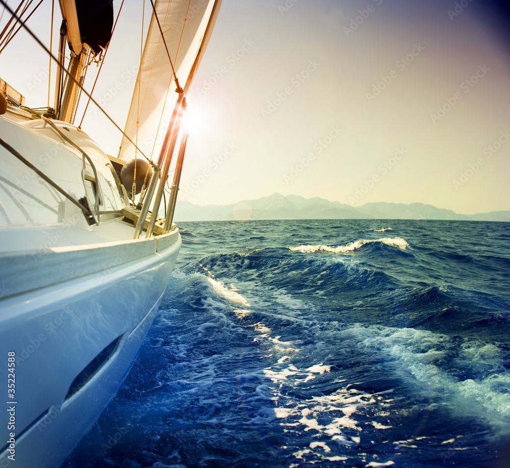 Yacht Sailing against sunset.Sailboat.Sepia toned - obrazy, fototapety, plakaty 