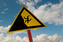 Triangular Danger Sign With Black Falling People