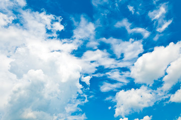 fluffy clouds in the blue sky