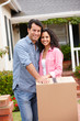 © Monkey Business - Hispanic couple moving into new house