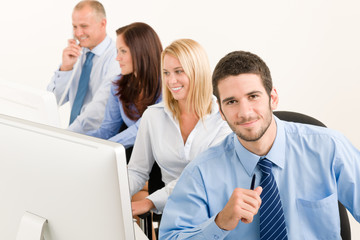 Business team happy sit in line behind table