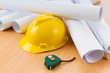 © Elnur - Drawings and hard hat on the desk