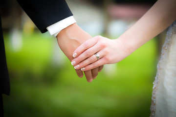 Young married couple holding hands