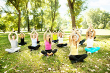Group Of People Doing Yoga Outdoor