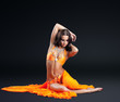 beauty naked dancer posing in orange veil 