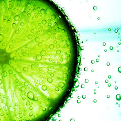 Wall Mural - lime slice in water