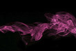 Abstract pink colored smoke, black background.
