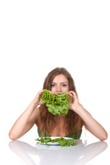 Wall Mural - young smile woman eat green raw salad leaf