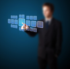 Poster - Businessman pressing high tech type of modern buttons