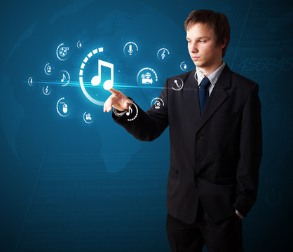 Businessman pressing virtual media type of buttons