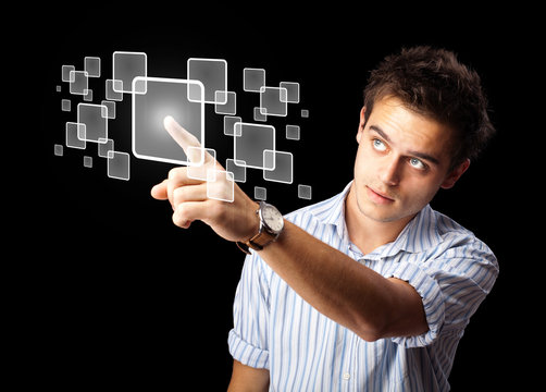Businessman pressing high tech type of modern buttons