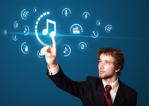 Businessman pressing virtual media type of buttons