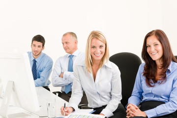 Wall Mural - Business team happy sit in line behind table