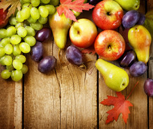 Organic Fruits Over Wood Background. Autumn Harvest