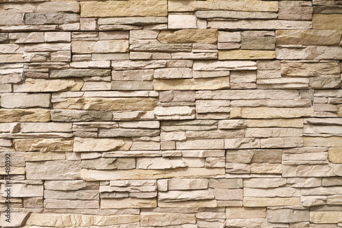 Naklejka dekoracyjna Stacked stone wall background horizontal