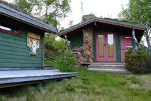 Traditional Norwegian Wooden House Standing On A Lawn .