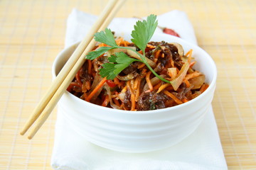 Wall Mural - Asian style salad with carrots, meat and chili peppers