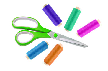 Green metal scissor and colorful sewing threads isolated on whit