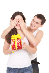 Young man presents gift to woman, on white background