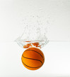 basketball under water with splash isolated on white background