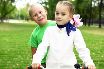 Girl on a bicycle in the green park