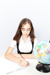 © Natalya Antoshchenko - schoolgirl writes the task