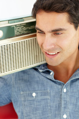 Wall Mural - Young man listening to radio