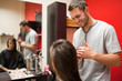 © WavebreakmediaMicro - Smiling male hairdresser cutting hair
