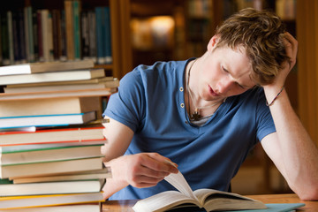 Poster - Tired man reading a book