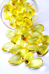 Wall Mural - Cod liver oil pills on white