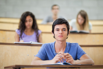 Poster - Focused students during a lecture