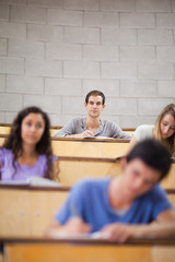 Poster - Portrait of young students during a lecture
