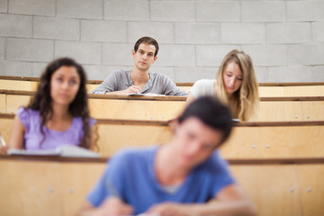 Poster - Young students during a lecture