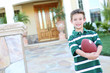 © Stephen Coburn - Young Boy at home with Football