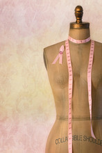Pink Breast Cancer Ribbon On Mannequin With Vintage Background