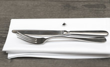 Big Fly On The Table And Table-napkin, Fork And Knife
