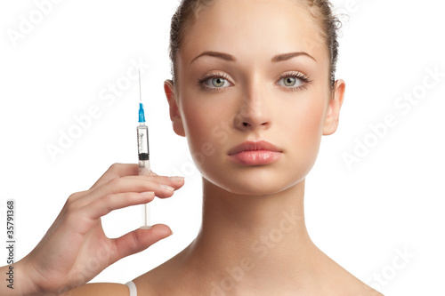 Beautiful woman with syringe in her hand Fototapeta