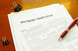 © zimmytws - Blank mortgage application with pen and clips