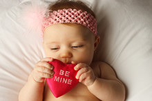 Baby Holding A Heart That Says Be Mine