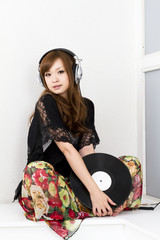 Wall Mural - Cool asian woman in headphone