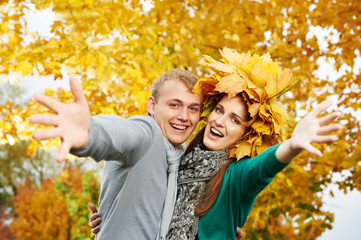 Young couple at autumn outdoors