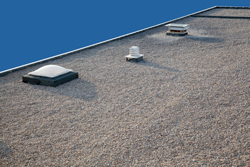 Inverted gravel roof chimney and skylight