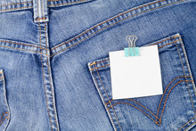 Jeans Back With White Paper Hanging In Pocket