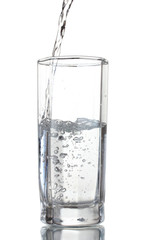 Sticker - Pouring water on glass isolated on white