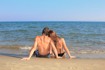 Wall Mural - Portrait of happy couple  on the beach