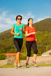 © Samo Trebizan - Two young women running outdoor