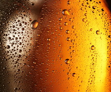 Texture Of Water Drops On The Bottle Of Beer.
