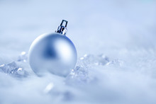 Christmas Silver Bauble On Fur Snow And Ice