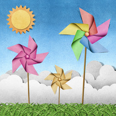 Wall Mural - windmill on grass recycled papercraft background